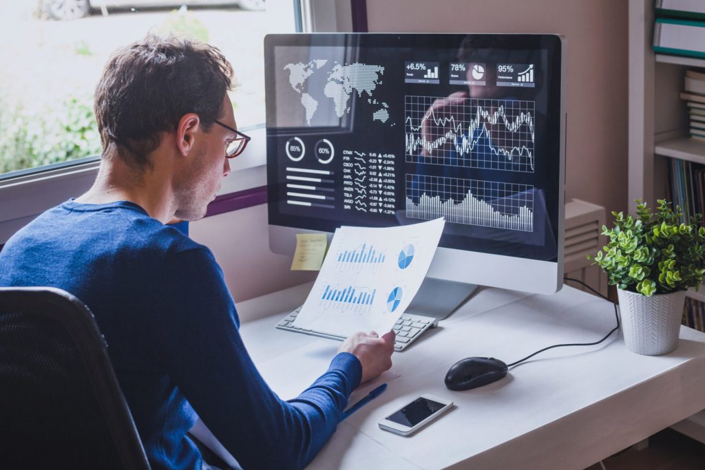 entrepreneur reading financial report on dashboard